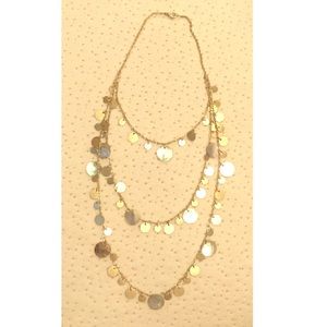 Layered gold and oyster shell necklace. Adjustable
